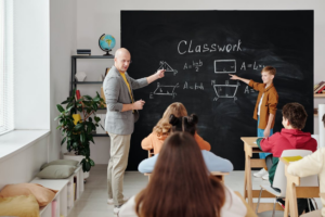 A classroom filled with students learning math before the lockdown.