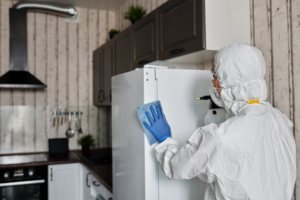 An individual disinfecting a commercial facility after a flood