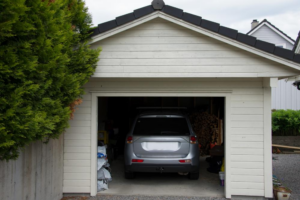  A clean and organized garage with an SUV parked inside