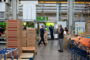 Employees cleaning warehouse to ensure maximum productivity.