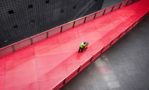 A janitor cleaning the space.