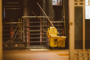 A old, yellow janitor’s cart.