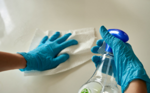 a person cleaning a surface