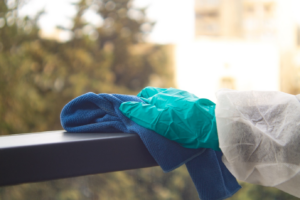 person cleaning a surface