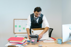 a man packing up his desk