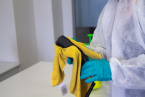 a person cleaning office equipment